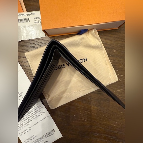 Authentic Louis Vuitton multiple wallet in Taiga Noir w/ receipt, jacket, & box - Picture 10 of 11